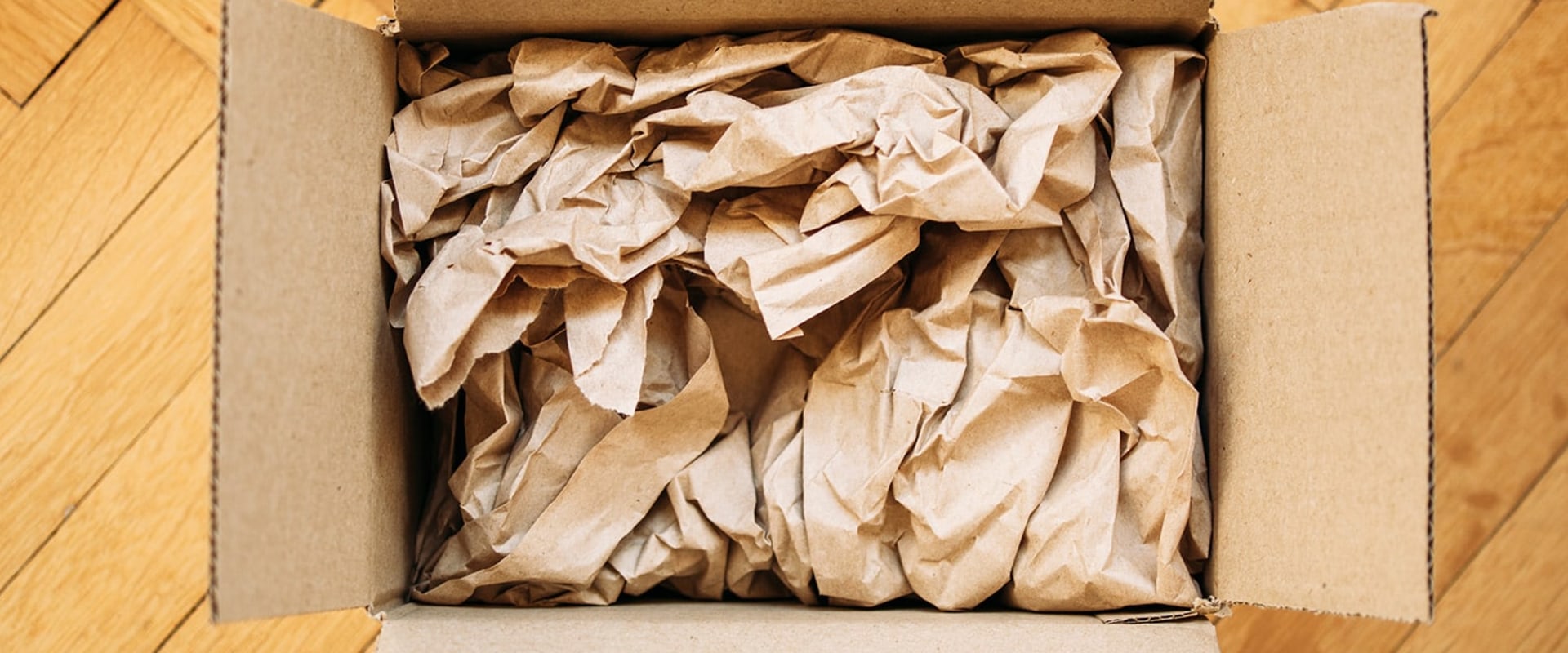 Filling Empty Spaces in Boxes with Foam Peanuts or Crumpled Paper